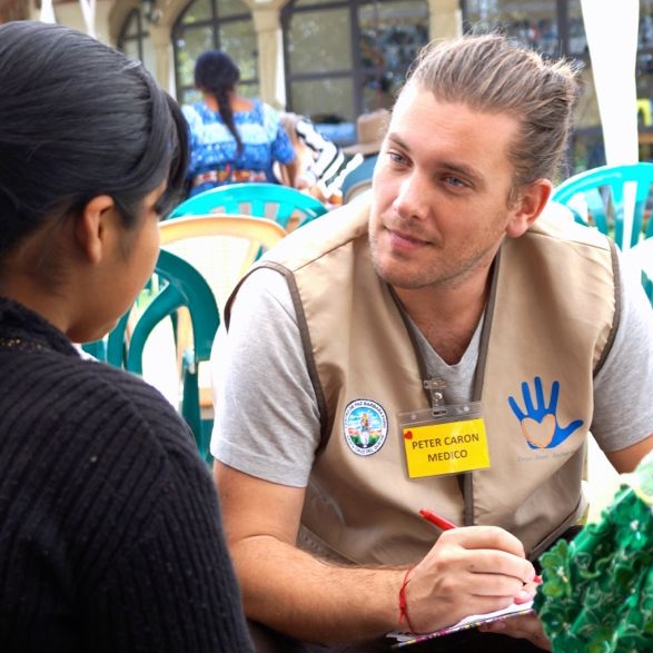 Dr. Caron speaking with a patient at a mission clinic in Guatemala