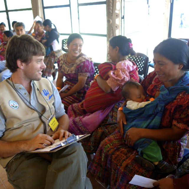 Dr. Caron taking a patient history at a temporary clinic in the Guatemalan highlands